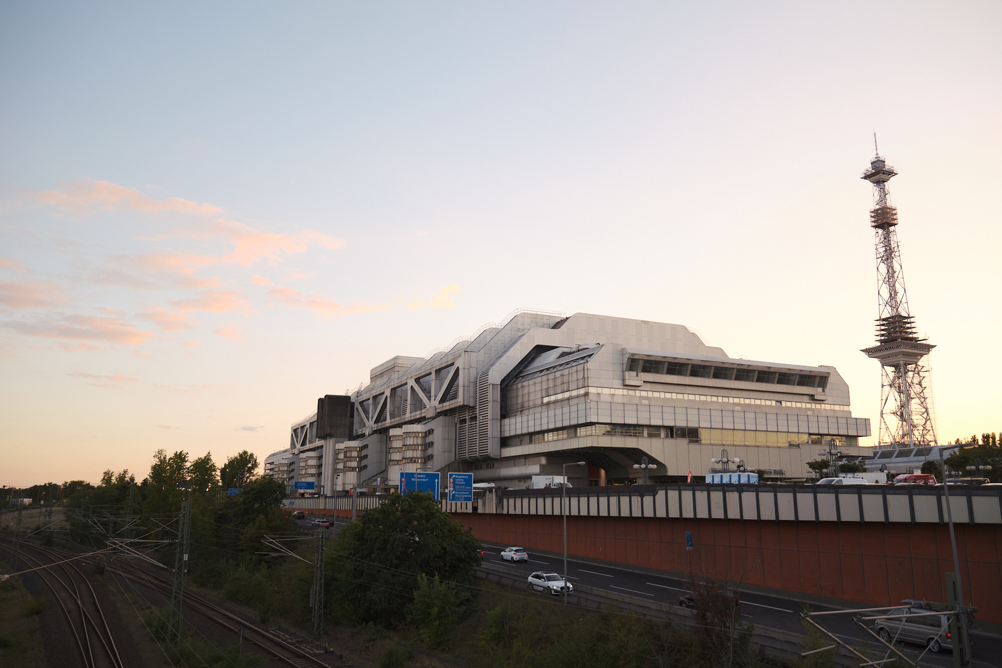 An outside view on the ICC just after sunset. In the background, the West Berlin TV Tower pretends to be the Eiffel tower.